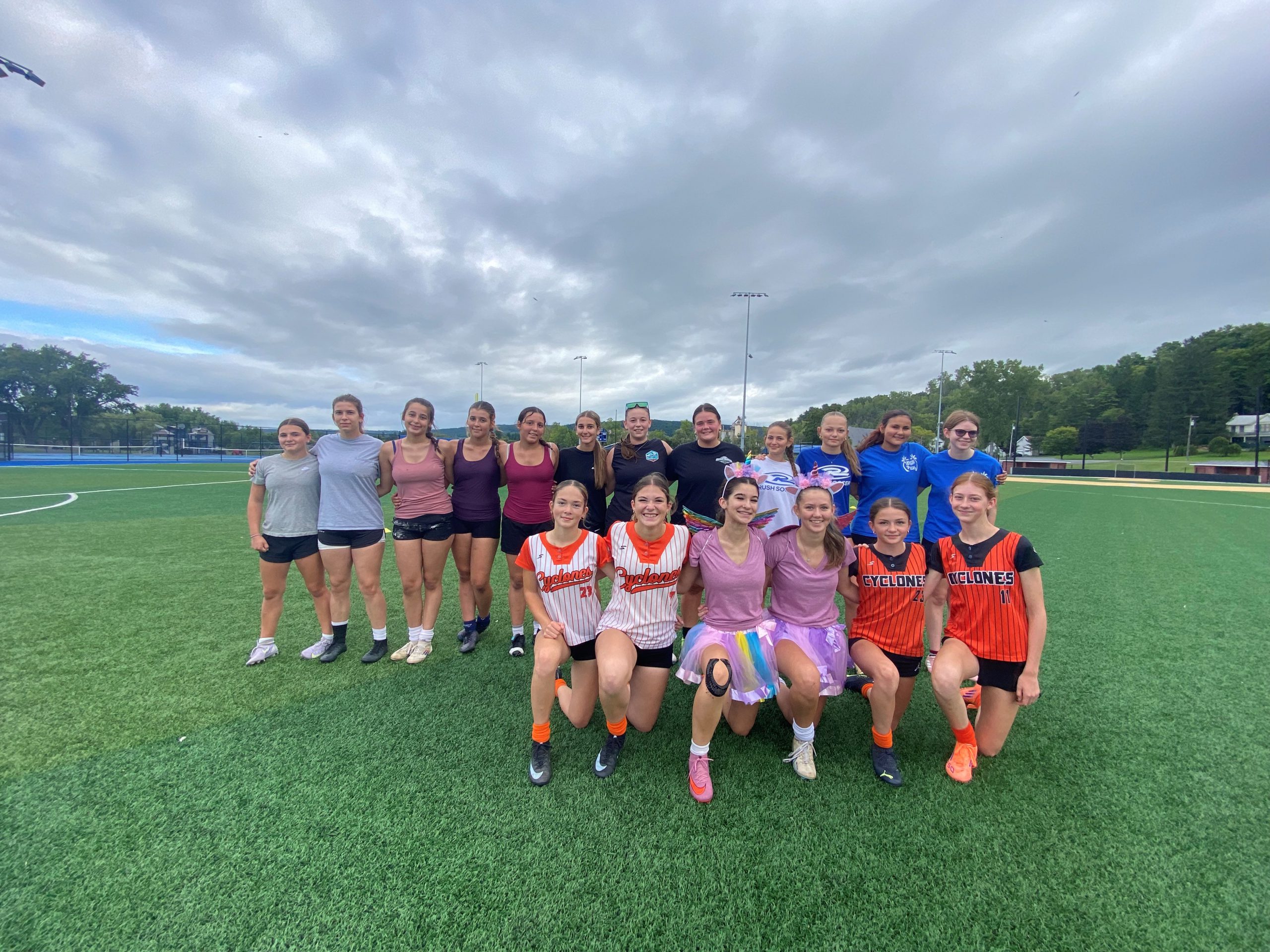 a girls soccer team poses for a photo