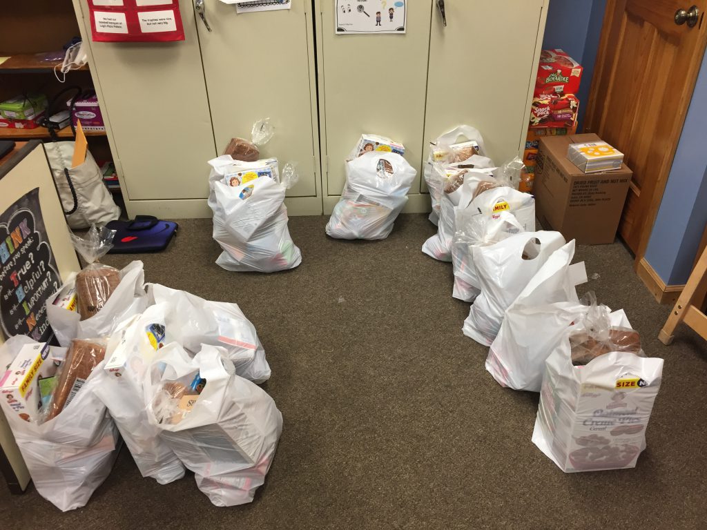 Bags of food are seen awaiting distribution
