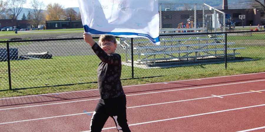 A student waves a flag