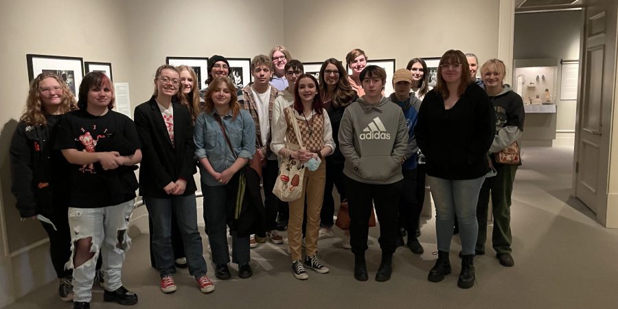 A group of students stands in a museum,