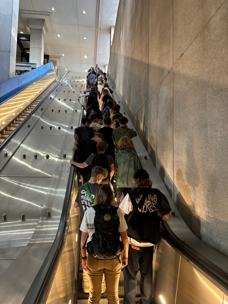 students on an escalator