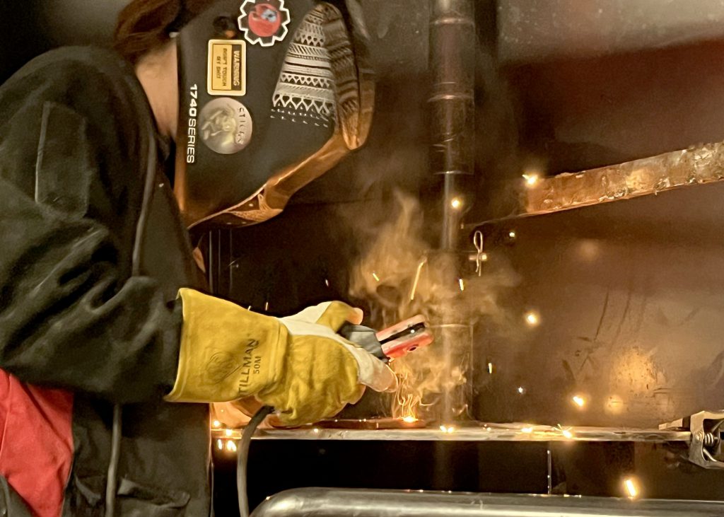 A student welds