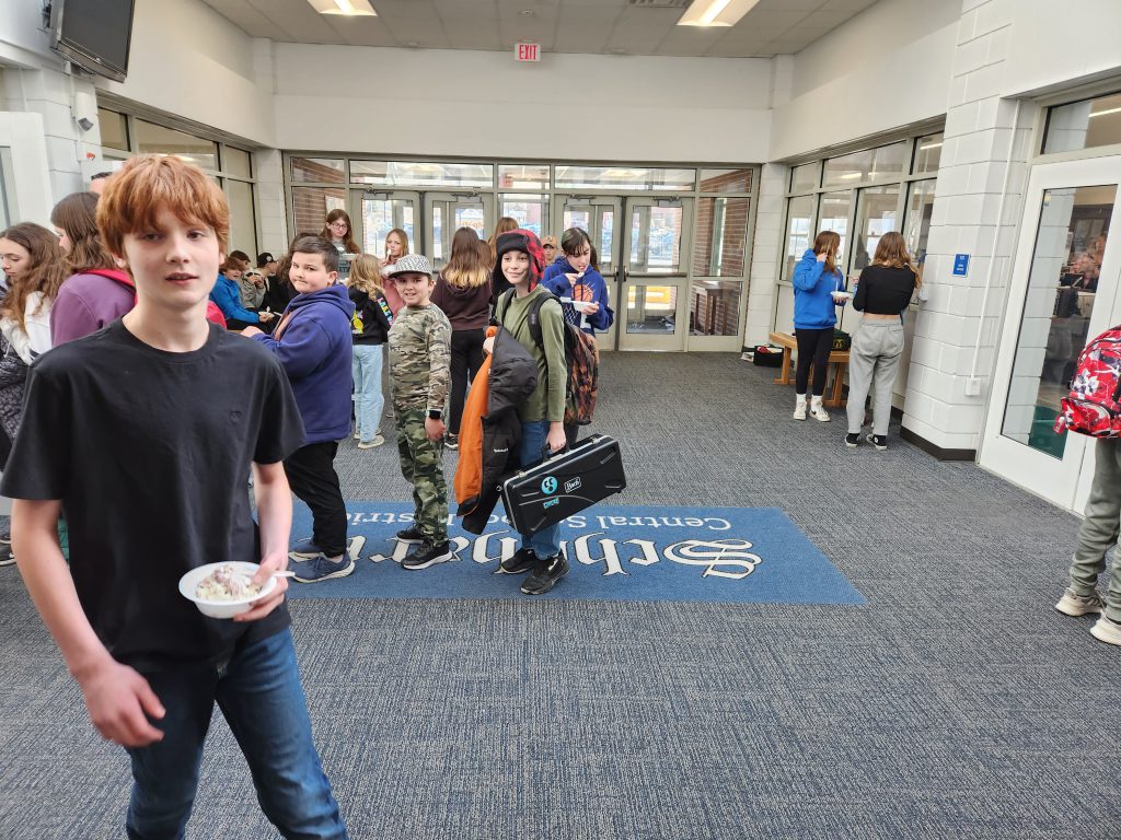 in a hallway students walk