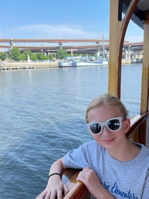 a student on a boat in the river