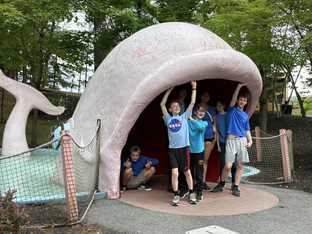 Students in the mouth of model whale