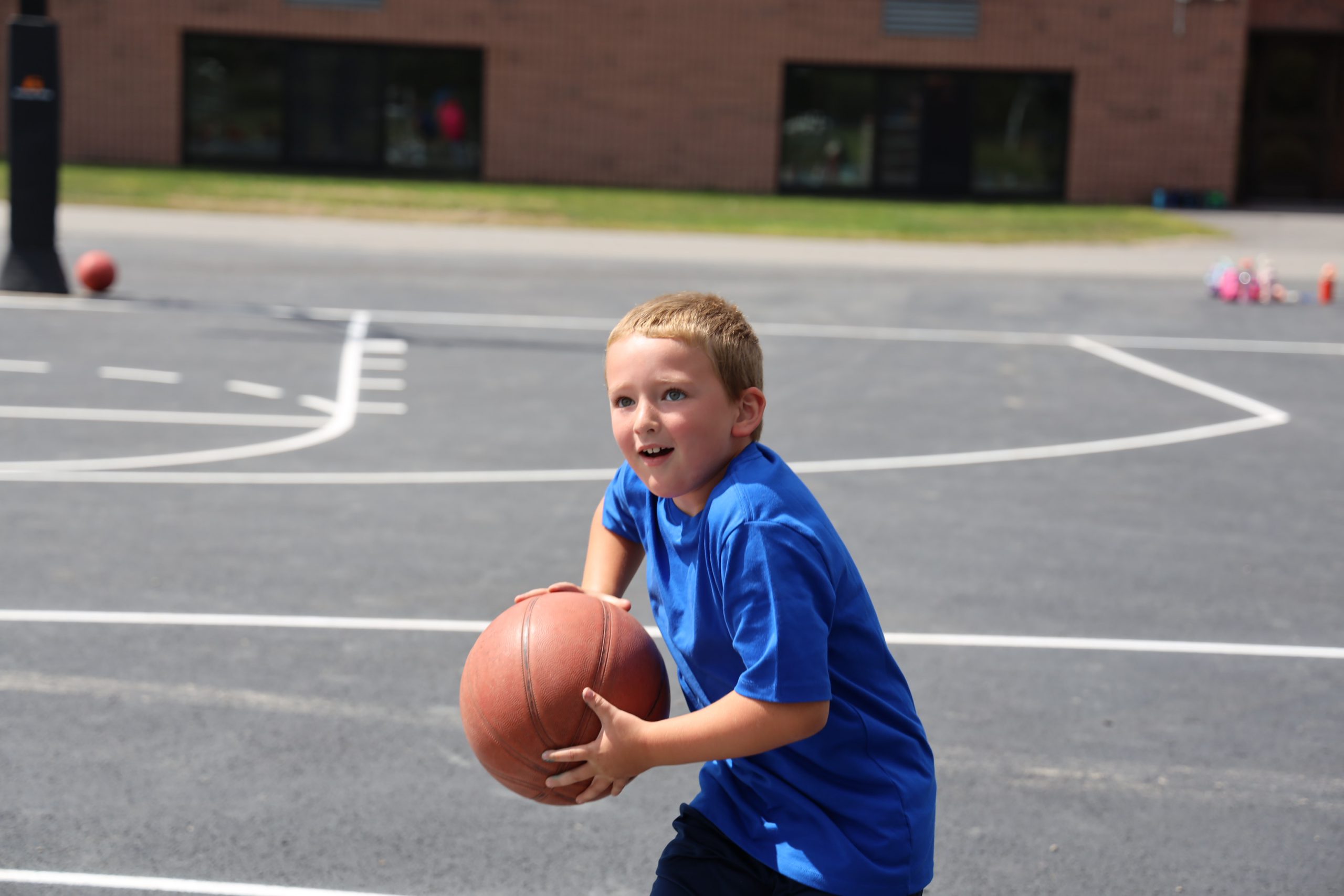 A student shoots a basketball