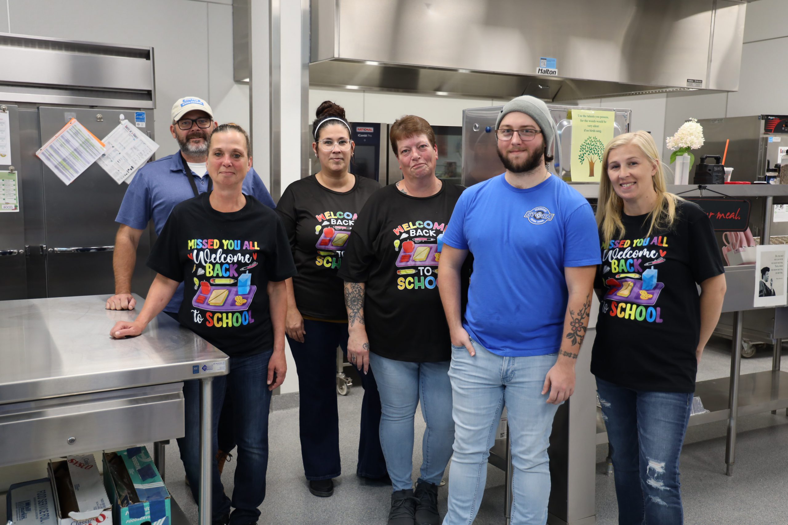 Cafeteria staff stand