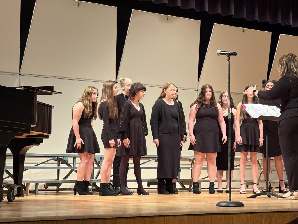 Students perform on stage