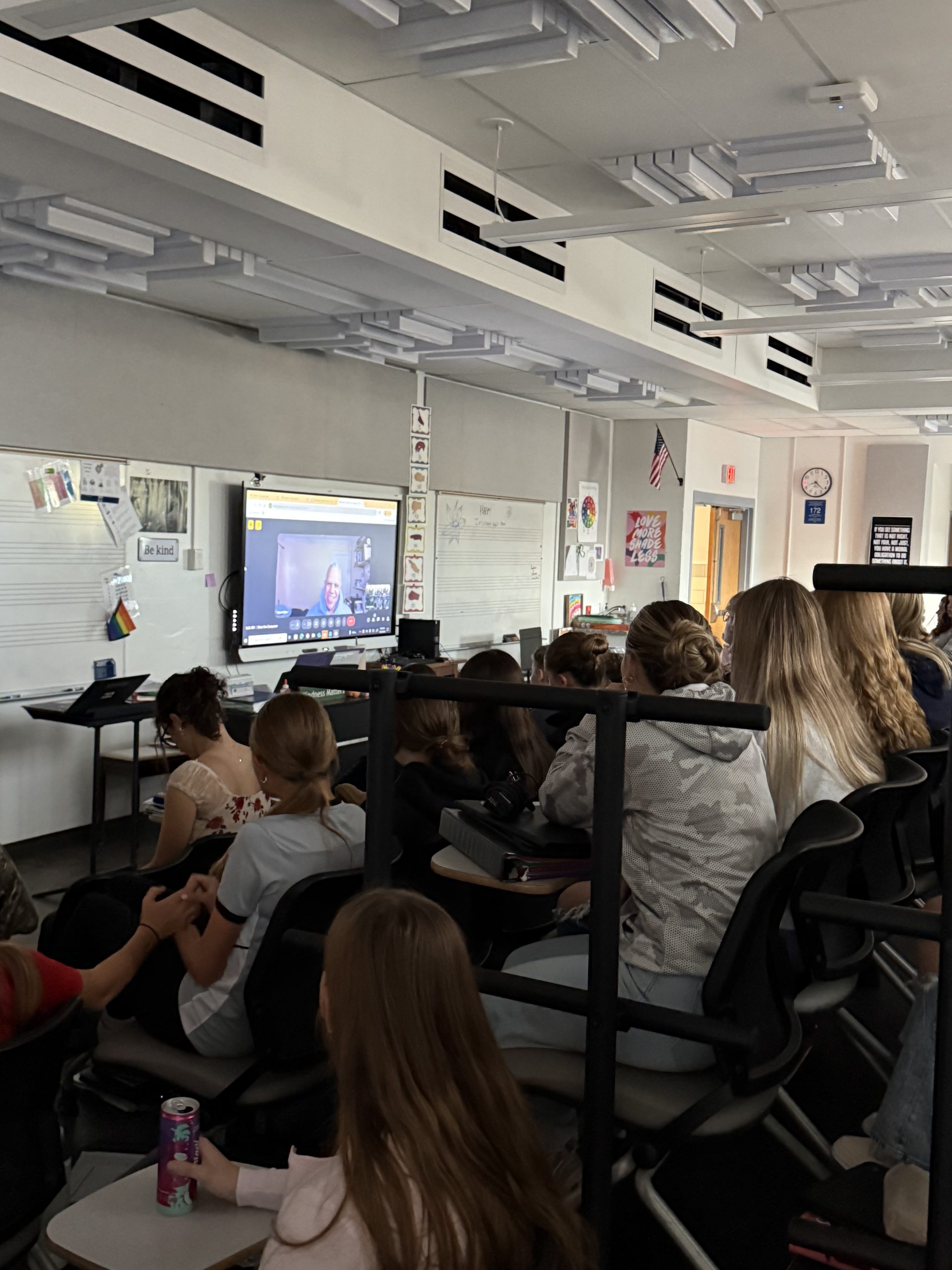 A classroom participates in a teleconference