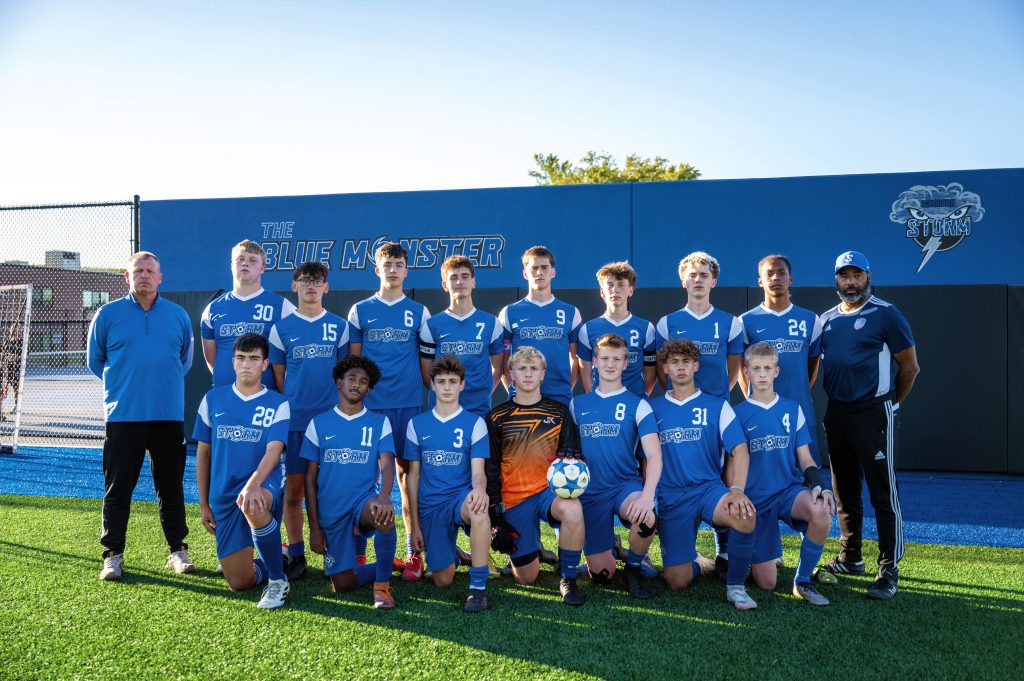 a sports team stands in front of a building