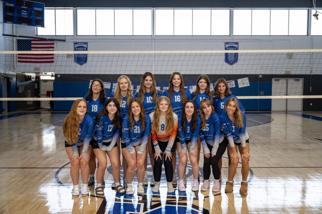 a sports team stands in a gym