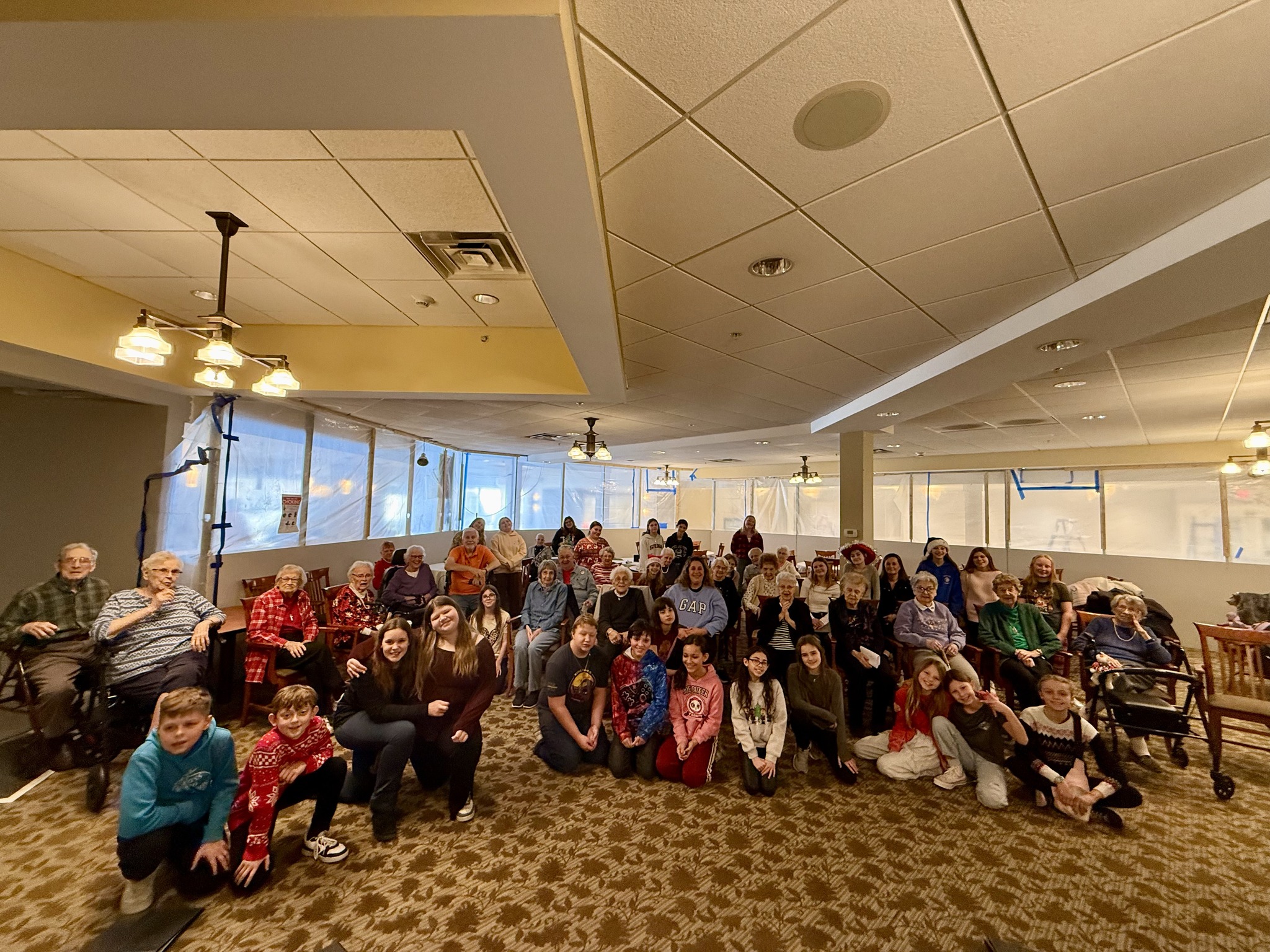 Students and seniors sit