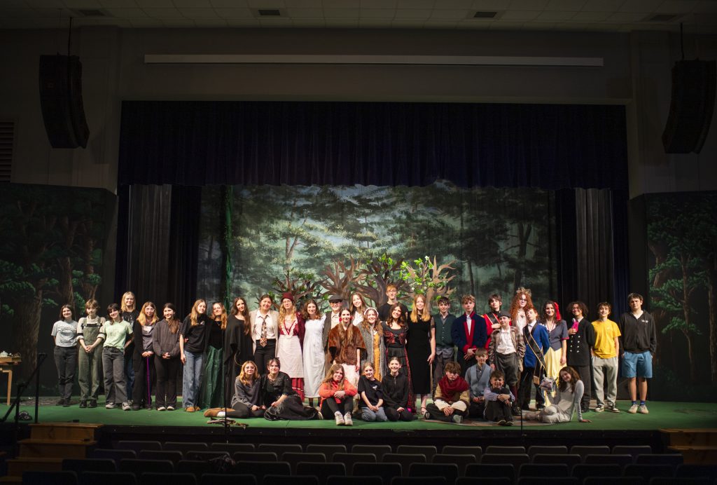 students in an ensemble on stage