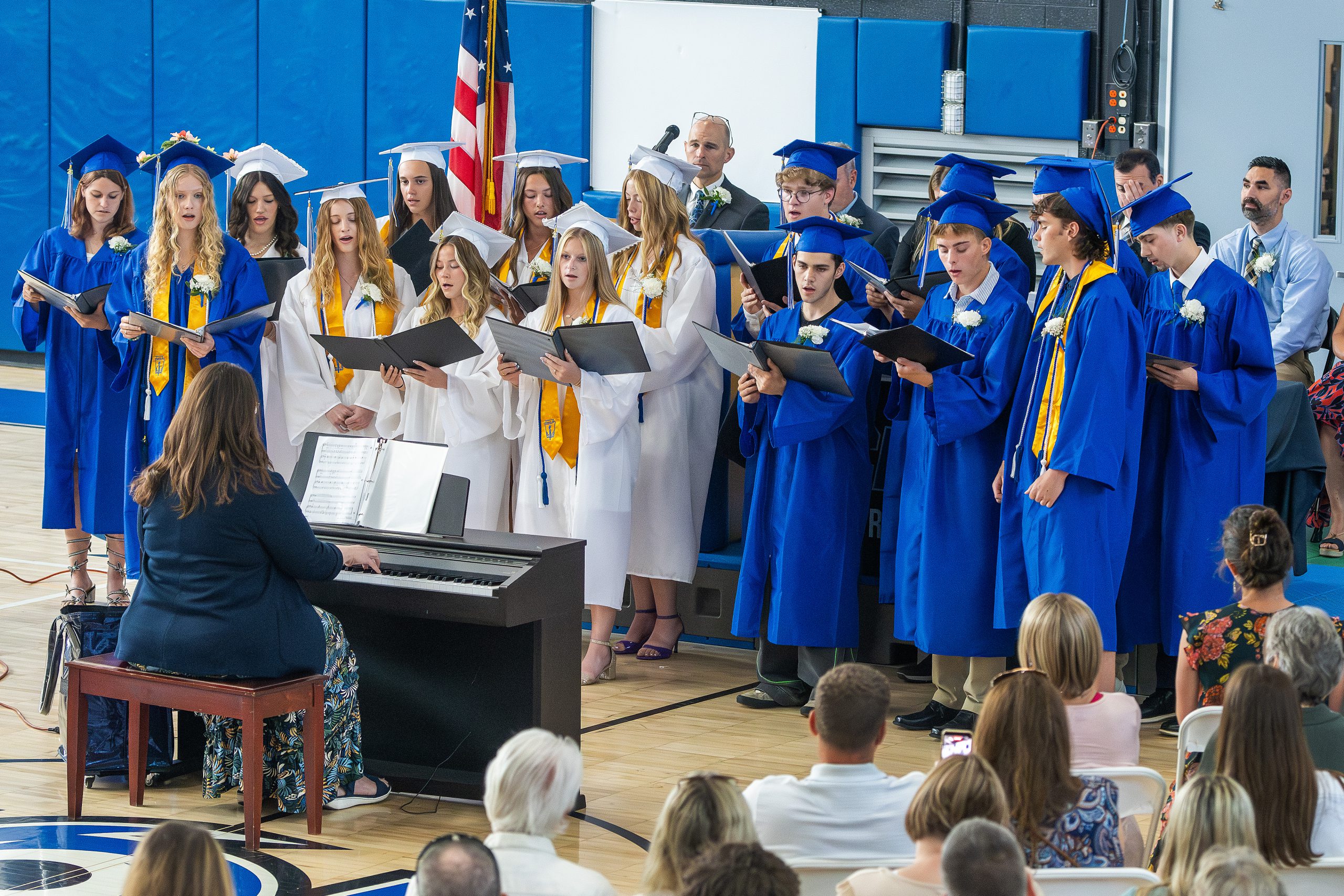 student sing at graduation