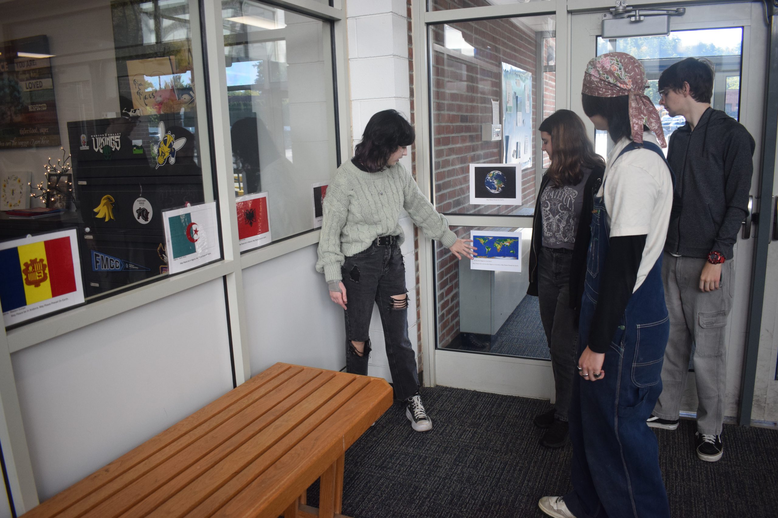 Students examine a flag display