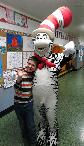 boy with Cat in the Hat in hallway