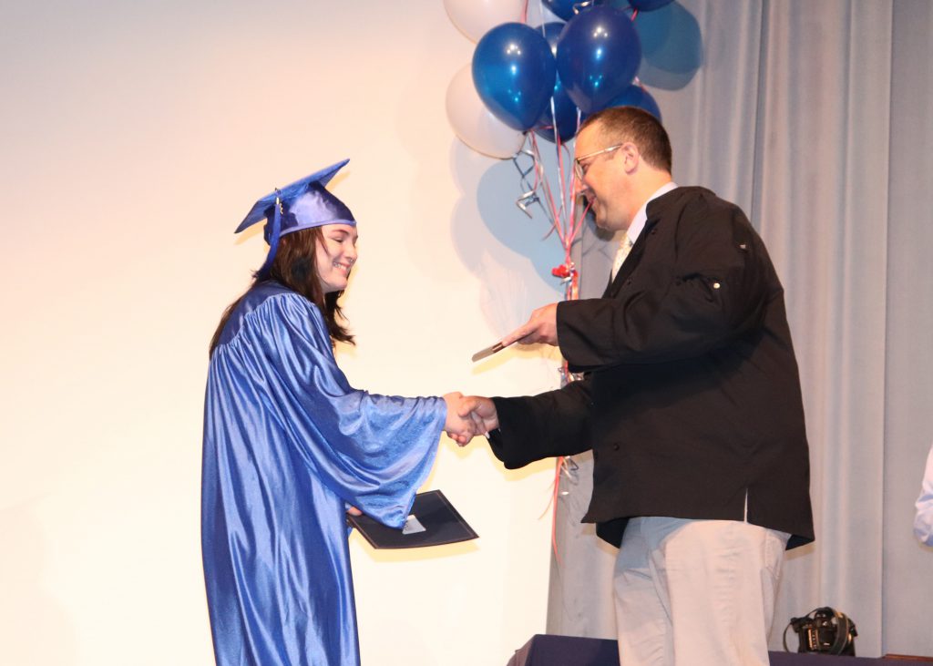 A student is given an award
