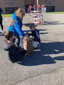 Students play with several blocks
