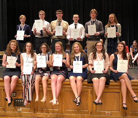 National Honor Society inductees pose with their certificates