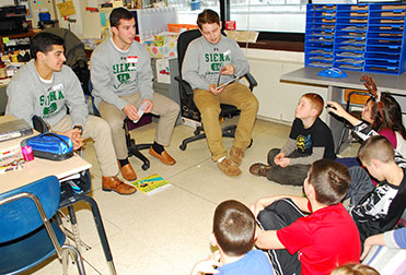 siena lacrosse players read to students