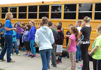 students line up for the bus