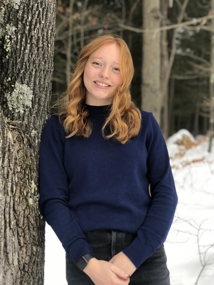 a student portrait against a tree