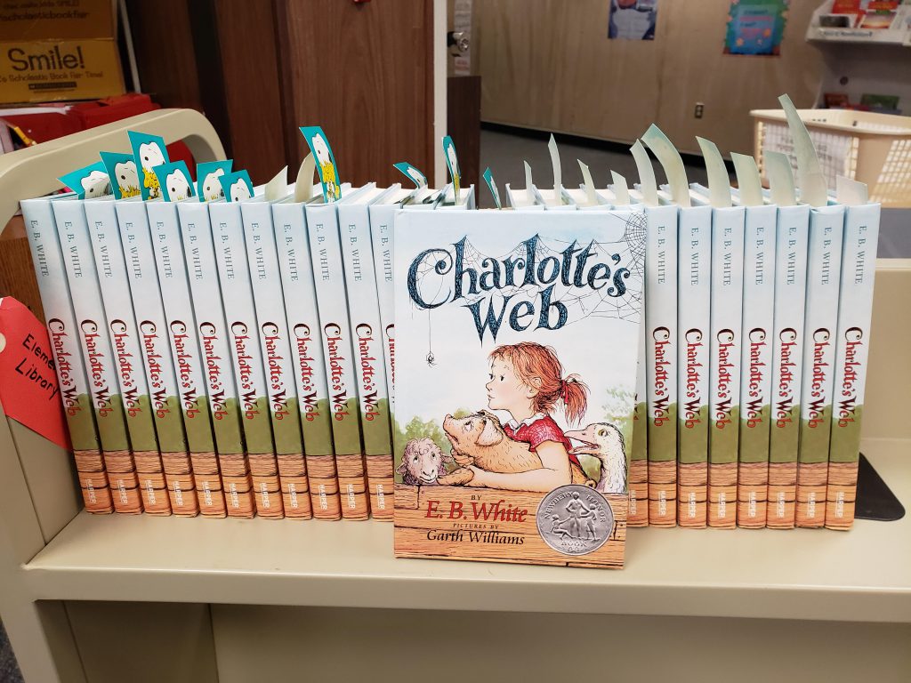 Copies of Charlotte's Web are seen on a shelf